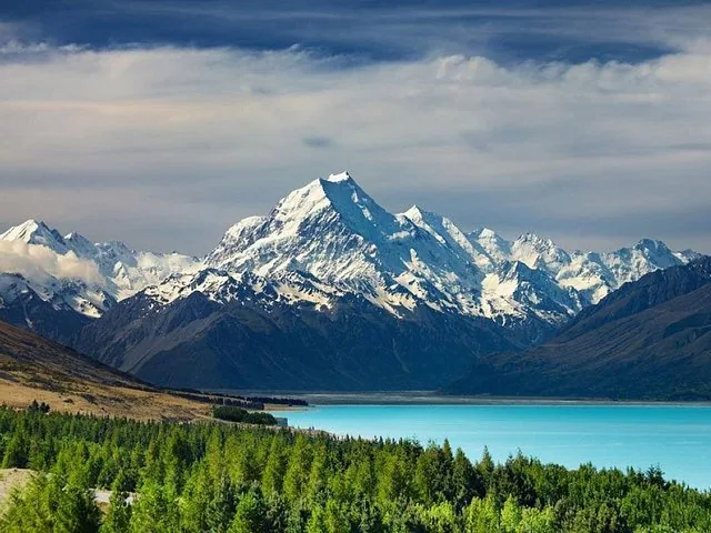 Scenic view of a bright blue lake and snow-capped mountain